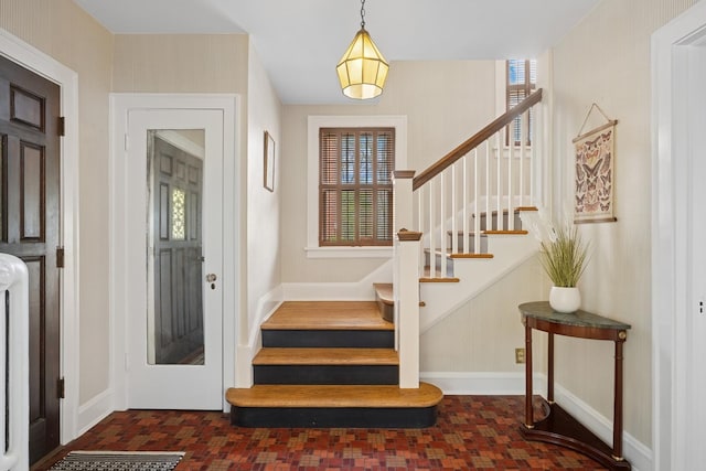1557 Green Bay Rd, Highland Park, IL 60035 - foyer entrance with plenty of natural light, stairway, and baseboards