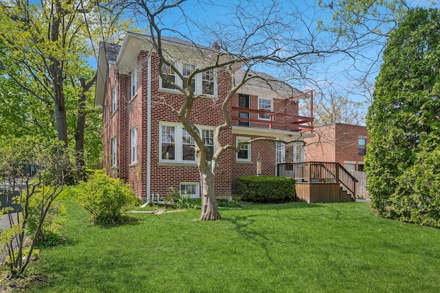 1557 Green Bay Rd, Highland Park, IL 60035 - back of property featuring brick siding, a yard, a chimney, and a wooden deck