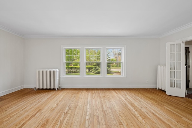 1557 Green Bay Rd, Highland Park, IL 60035 - spare room featuring radiator, ornamental molding, baseboards, and wood finished floors