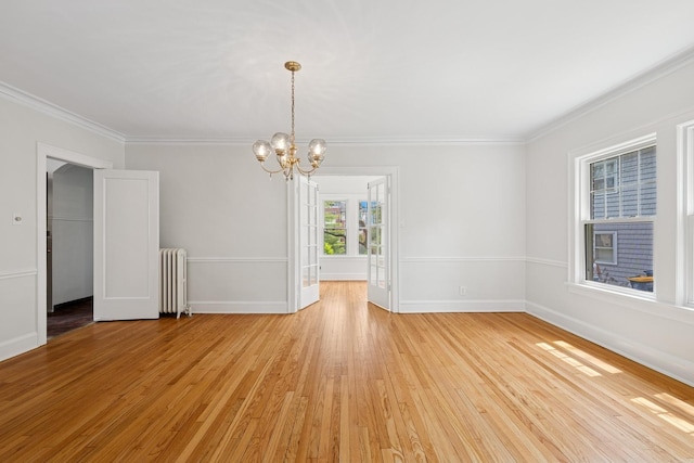 1557 Green Bay Rd, Highland Park, IL 60035 - empty room with radiator heating unit, light wood-style floors, a chandelier, crown molding, and baseboards