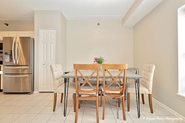 390 W Mahogany Ct Unit 301, Palatine, IL 60067 - dining space featuring light tile patterned flooring and baseboards