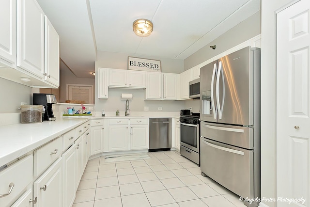 390 W Mahogany Ct Unit 301, Palatine, IL 60067 - kitchen featuring stainless steel appliances, light tile patterned flooring, white cabinetry, and light countertops