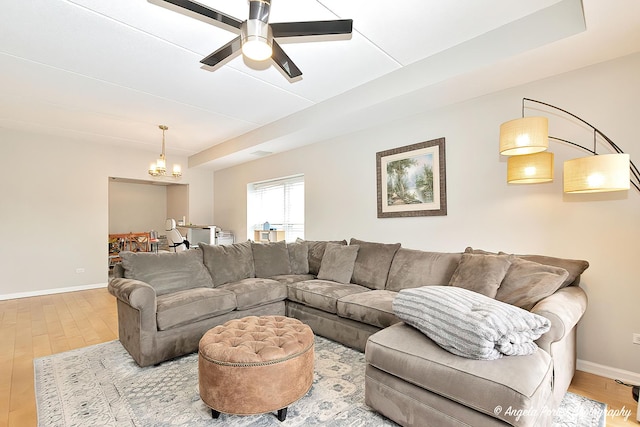 390 W Mahogany Ct Unit 301, Palatine, IL 60067 - living room with wood finished floors, a chandelier, ceiling fan, and baseboards