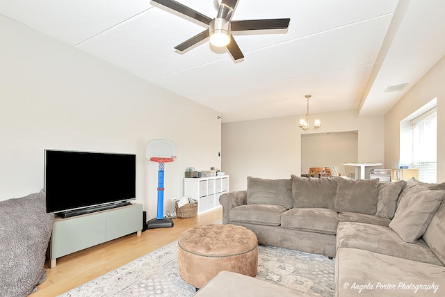 390 W Mahogany Ct Unit 301, Palatine, IL 60067 - living room featuring wood finished floors, a chandelier, and a ceiling fan