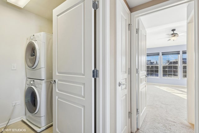 15130 Laurel Ln, Lockport, IL 60441 - laundry room with stacked washer and clothes dryer, light colored carpet, ceiling fan, and baseboards