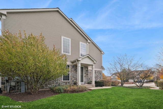 15130 Laurel Ln, Lockport, IL 60441 - view of front facade featuring stone siding and a front lawn