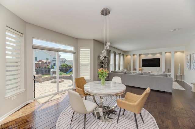 141 Bluegrass Pkwy, Oswego, IL 60543 - dining room featuring dark wood-style flooring and baseboards