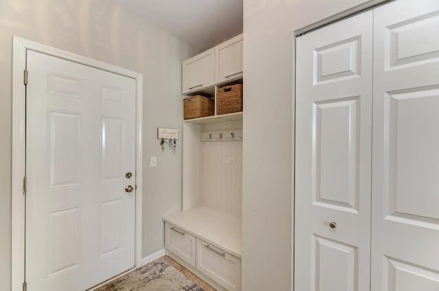 141 Bluegrass Pkwy, Oswego, IL 60543 - mudroom with baseboards