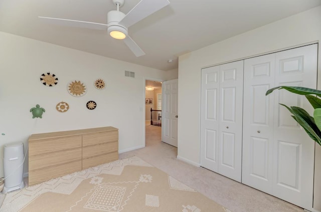 141 Bluegrass Pkwy, Oswego, IL 60543 - bedroom featuring carpet flooring, a closet, ceiling fan, and baseboards