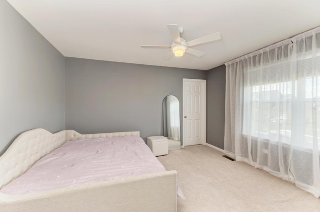 141 Bluegrass Pkwy, Oswego, IL 60543 - bedroom featuring light carpet, baseboards, and a ceiling fan