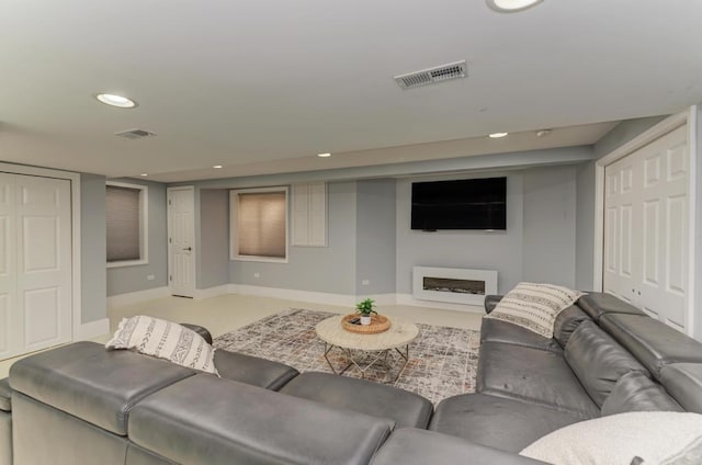 141 Bluegrass Pkwy, Oswego, IL 60543 - living room with recessed lighting, a fireplace, and baseboards