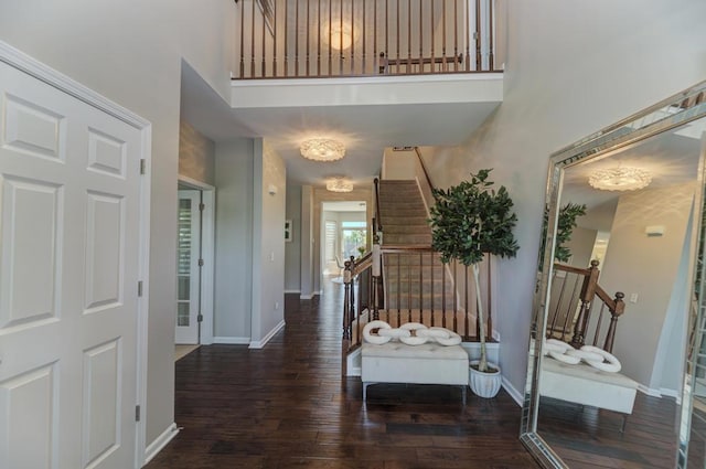 141 Bluegrass Pkwy, Oswego, IL 60543 - entrance foyer with stairs, hardwood / wood-style flooring, a high ceiling, and baseboards