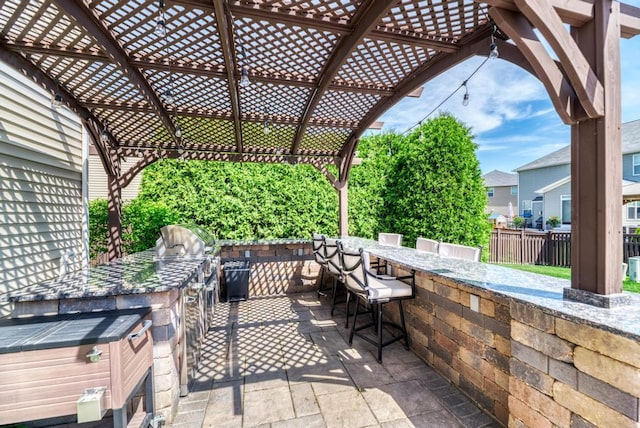 141 Bluegrass Pkwy, Oswego, IL 60543 - view of patio with area for grilling, a pergola, and fence