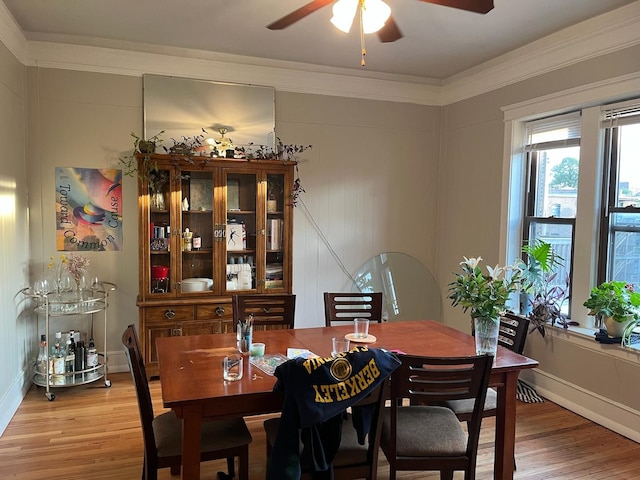 5110 S Woodlawn Ave Unit 3H, Chicago, IL 60615 - dining room featuring light wood-style floors, ceiling fan, ornamental molding, and a decorative wall