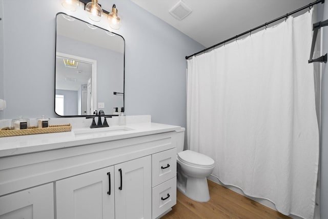 14530 General Dr, Plainfield, IL 60544 - full bath with toilet, wood finished floors, and vanity