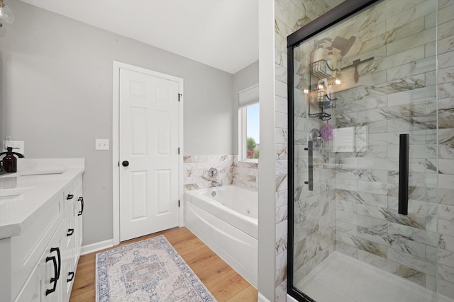 14530 General Dr, Plainfield, IL 60544 - bathroom featuring a stall shower, a bath, wood finished floors, and double vanity