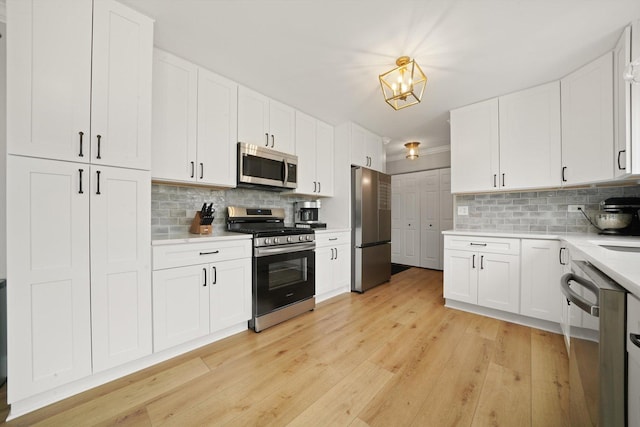 14530 General Dr, Plainfield, IL 60544 - kitchen with stainless steel appliances, light countertops, and decorative backsplash