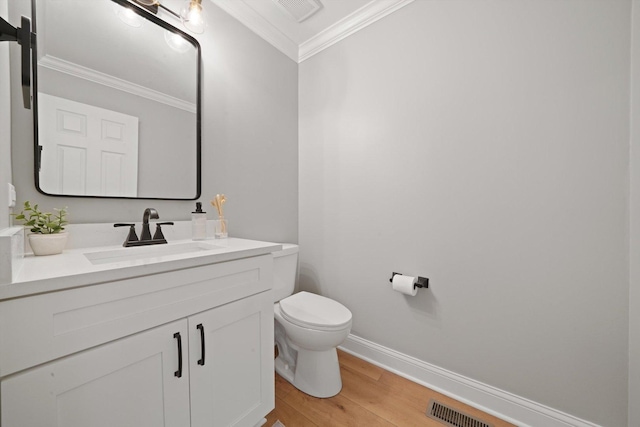 14530 General Dr, Plainfield, IL 60544 - bathroom with ornamental molding, toilet, wood finished floors, baseboards, and vanity