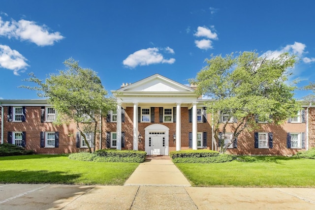 501 Coventry Ln Unit 3, Crystal Lake, IL 60014 - greek revival house featuring a front lawn and brick siding