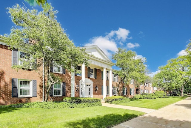 501 Coventry Ln Unit 3, Crystal Lake, IL 60014 - neoclassical home with a front lawn and brick siding