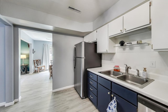 501 Coventry Ln Unit 3, Crystal Lake, IL 60014 - kitchen with appliances with stainless steel finishes, a sink, light countertops, and white cabinetry