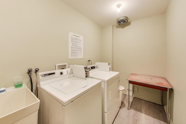 501 Coventry Ln Unit 3, Crystal Lake, IL 60014 - communal laundry room with light wood-type flooring and independent washer and dryer