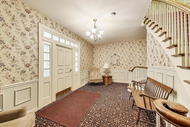 501 Coventry Ln Unit 3, Crystal Lake, IL 60014 - entryway featuring a chandelier, a wainscoted wall, stairway, a decorative wall, and wallpapered walls