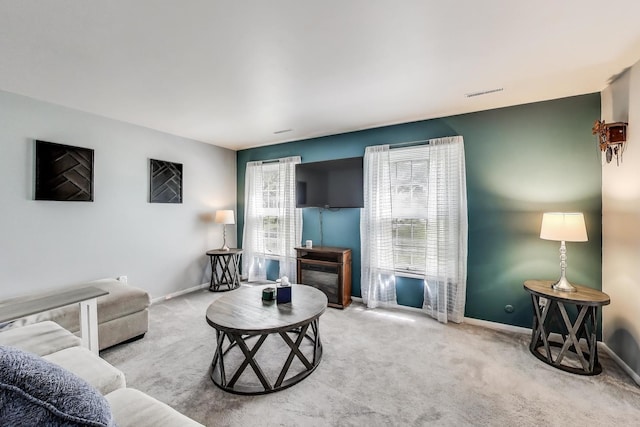 501 Coventry Ln Unit 3, Crystal Lake, IL 60014 - carpeted living room featuring baseboards and a fireplace