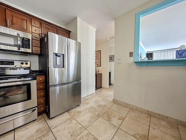 6171 N Sheridan Rd Unit 402, Chicago, IL 60660 - kitchen with appliances with stainless steel finishes, light tile patterned floors, baseboards, and dark countertops