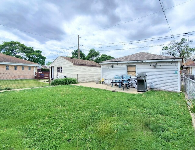 4510 N Menard Ave, Chicago, IL 60630 - back of house featuring a fenced backyard and a patio area
