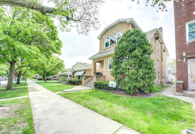 4510 N Menard Ave, Chicago, IL 60630 - view of front of home with a front lawn and brick siding