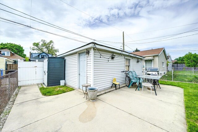 4510 N Menard Ave, Chicago, IL 60630 - rear view of house with a patio area and a fenced backyard