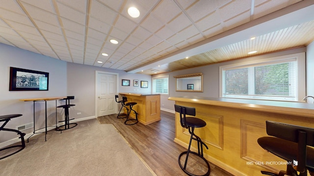 2653 Clara Ave, Aurora, IL 60502 - indoor dry bar with baseboards, recessed lighting, wood finished floors, and carpet
