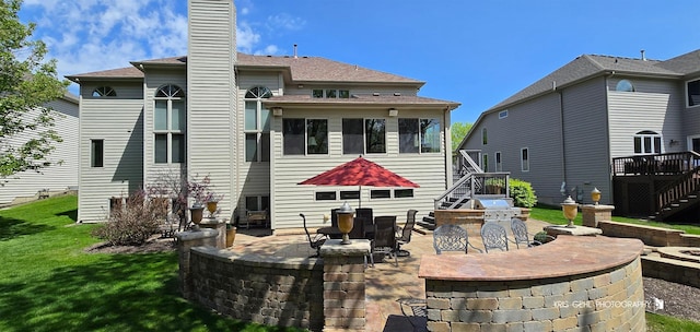 2653 Clara Ave, Aurora, IL 60502 - back of house with stairs, a patio area, a chimney, a lawn, and a deck