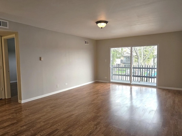4B Kingery Quarter Unit 206, Willowbrook, IL 60527 - unfurnished room featuring dark wood finished floors and baseboards