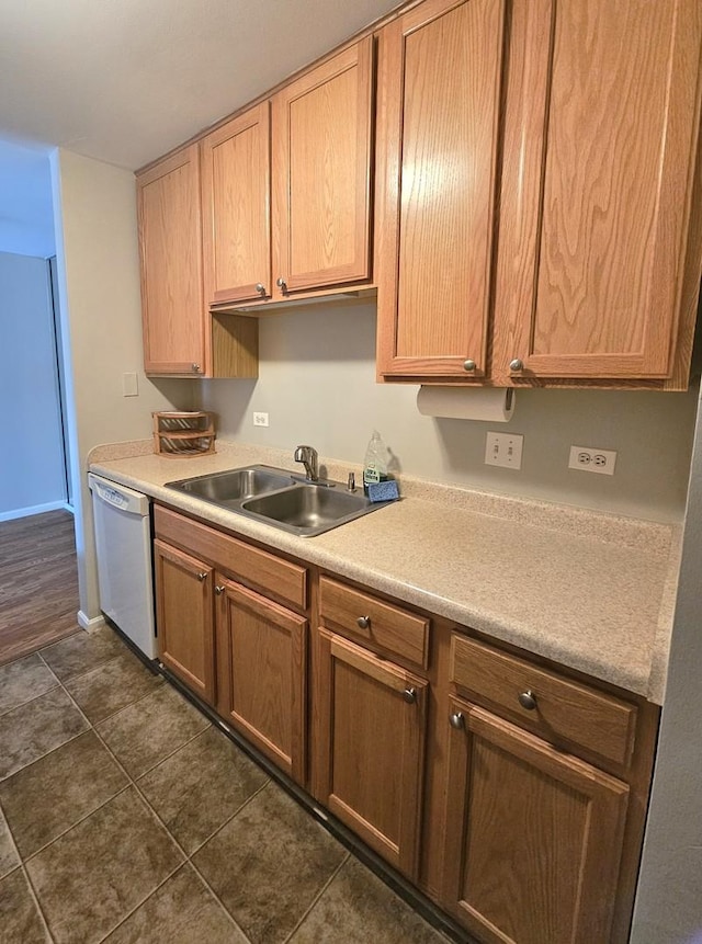 4B Kingery Quarter Unit 206, Willowbrook, IL 60527 - kitchen with white dishwasher, a sink, light countertops, dark tile patterned floors, and baseboards