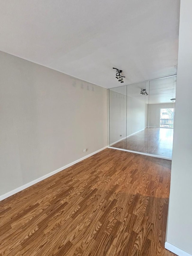 4B Kingery Quarter Unit 206, Willowbrook, IL 60527 - spare room with wood finished floors and baseboards