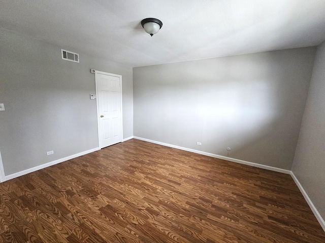 4B Kingery Quarter Unit 206, Willowbrook, IL 60527 - unfurnished room featuring dark wood finished floors and baseboards