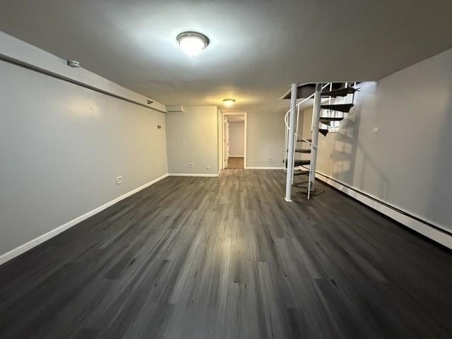 39 King Arthur Ct Unit 10, Northlake, IL 60164 - finished below grade area featuring stairway, dark wood finished floors, and baseboards