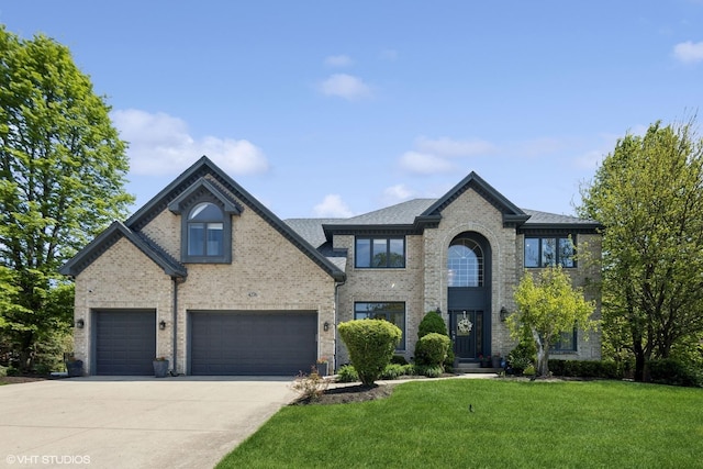 4276 Colton Cir, Naperville, IL 60564 - view of front of house with concrete driveway, a front yard, brick siding, and a shingled roof