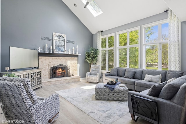 4276 Colton Cir, Naperville, IL 60564 - living room with high vaulted ceiling, a skylight, a fireplace, and wood finished floors