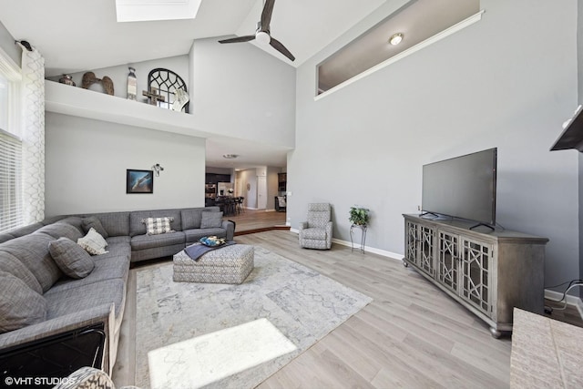 4276 Colton Cir, Naperville, IL 60564 - living area featuring ceiling fan, wood finished floors, a skylight, baseboards, and high vaulted ceiling
