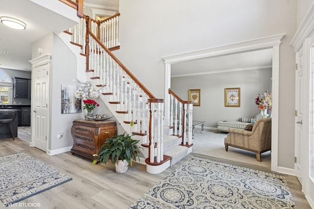 4276 Colton Cir, Naperville, IL 60564 - entryway with light wood-type flooring, stairs, baseboards, and ornamental molding