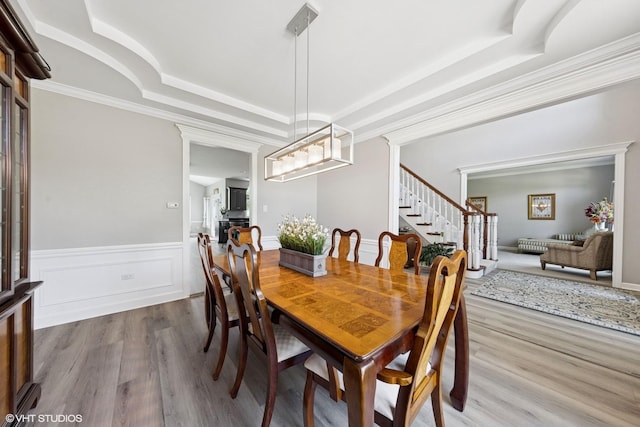 4276 Colton Cir, Naperville, IL 60564 - dining area with a tray ceiling, stairs, wood finished floors, wainscoting, and crown molding