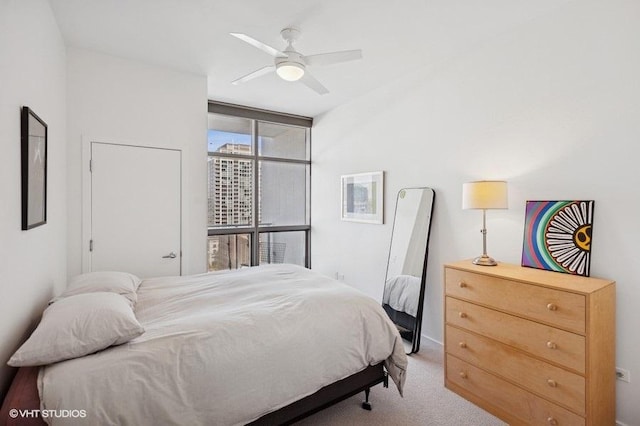 303 W Ohio St Unit 1509, Chicago, IL 60654 - bedroom with carpet, floor to ceiling windows, ceiling fan, and baseboards
