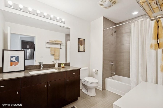 303 W Ohio St Unit 1509, Chicago, IL 60654 - full bathroom with wood finished floors, toilet, shower / tub combo with curtain, and vanity