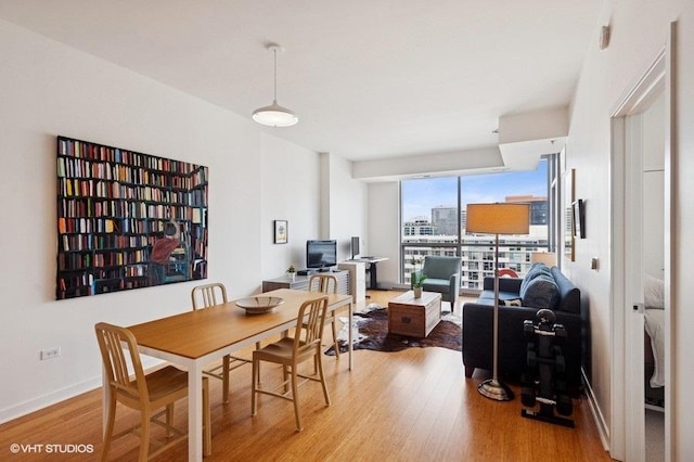 303 W Ohio St Unit 1509, Chicago, IL 60654 - dining area featuring wood finished floors and baseboards