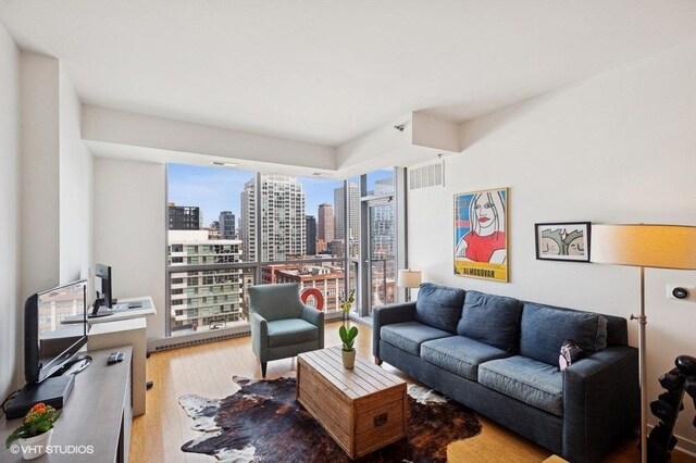 303 W Ohio St Unit 1509, Chicago, IL 60654 - living room featuring light wood-style floors