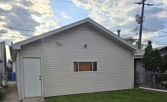 rear view of house featuring fence