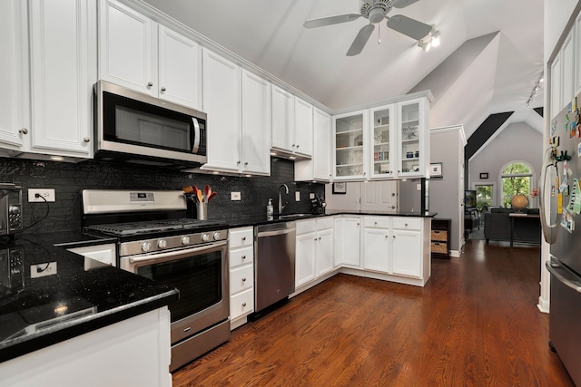 2117 W Evergreen Ave Unit 3E, Chicago, IL 60622 - kitchen featuring appliances with stainless steel finishes, vaulted ceiling, ceiling fan, backsplash, and white cabinetry